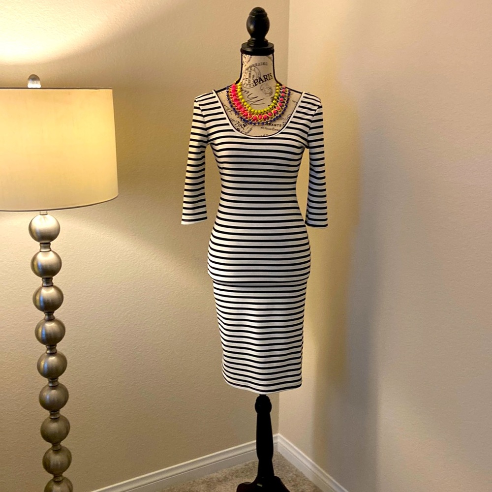 Size small black and white long sleeved midi dress. Like new. Worn once.